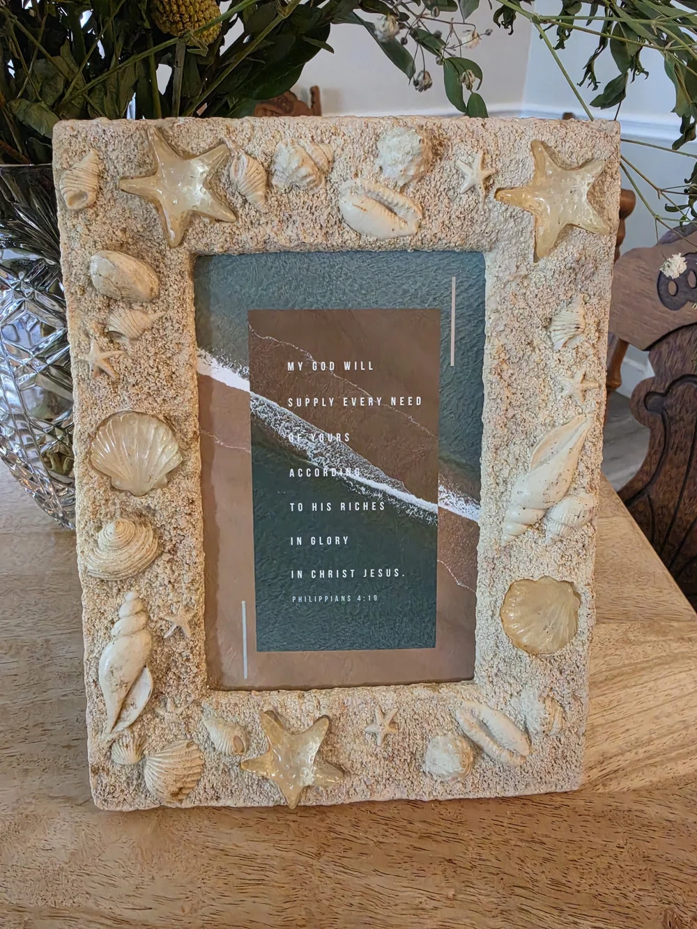 Textured beach picture frame decorated with real seashells and faux-sand finish